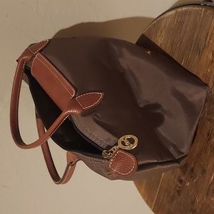 Longchamp foldable bag. Unused. Tan with gold and brown leather.